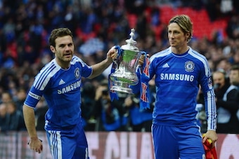 LONDON, ENGLAND - MAY 05: Juan Mata of Chelsea and Fernando Torres of Chelsea celebrate with the trophy after the FA Cup with Budweiser Final match between Liverpool and Chelsea at Wembley Stadium on May 5, 2012 in London, England. (Photo by Shaun Botter LONDON, ENGLAND - MAY 05: Juan Mata of Chelsea and Fernando Torres of Chelsea celebrate with the trophy after the FA Cup with Budweiser Final match between Liverpool and Chelsea at Wembley Stadium on May 5, 2012 in London, England. (Photo by Shaun Botter
