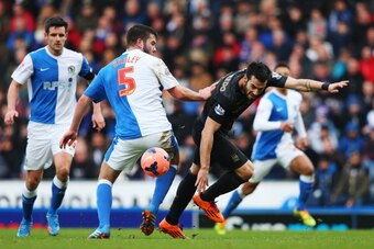 BLACKBURN, ENGLAND - JANUARY 04:  Grant Hanley (L) of Blackburn Rovers and Alvaro Negredo (R) of Manchester City challenge for the ball during the Budweiser FA Cup third round match between Blackburn Rovers and Manchester City at Ewood Park on January 4, 