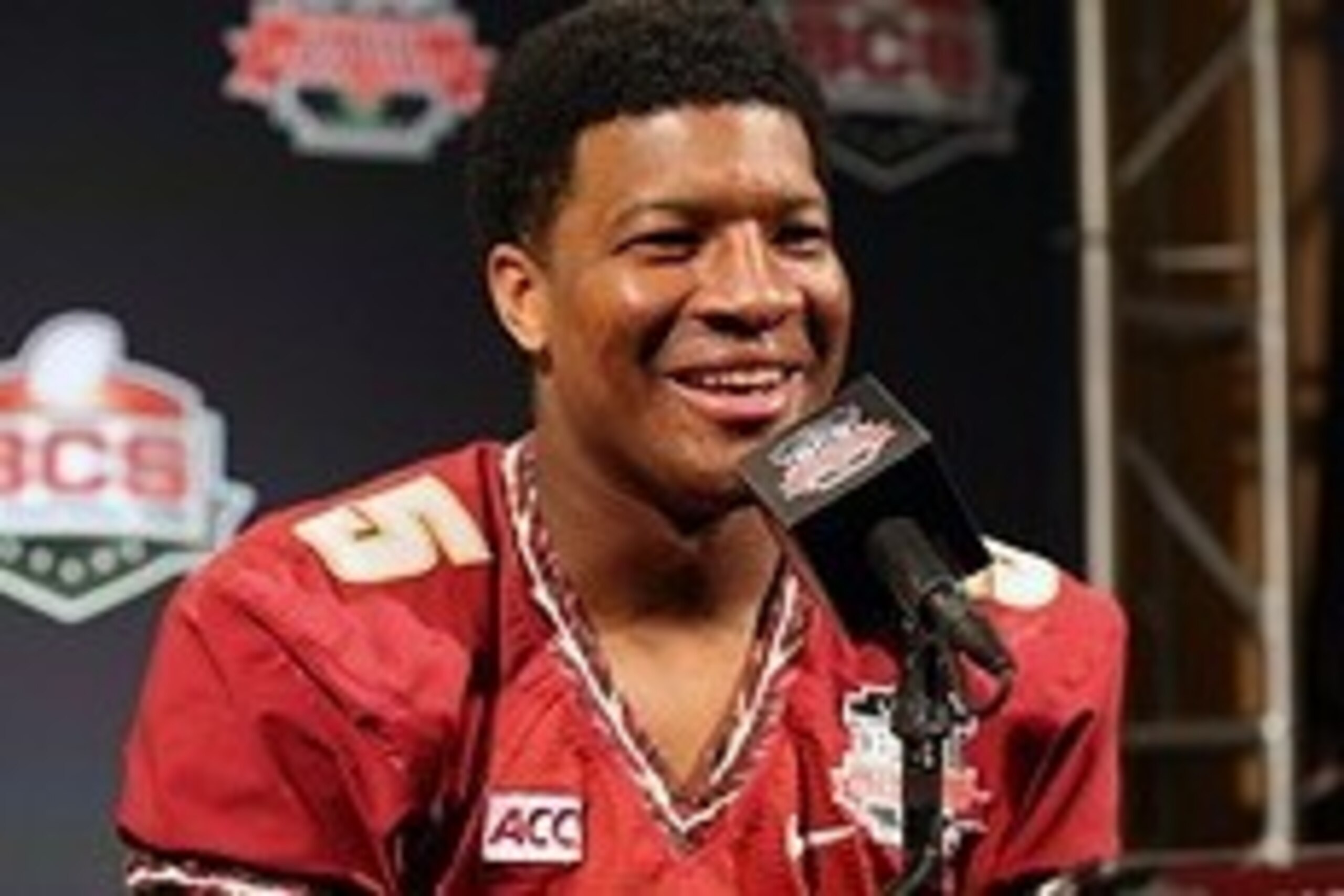 Jan 4, 2014; Newport Beach, CA, USA; Florida State Seminoles quarterback Jameis Winston (5) smiles as he answers questions during Media Day at Newport Beach Marriott. Mandatory Credit: Matthew Emmons-USA TODAY Sports
