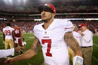 GLENDALE, AZ - DECEMBER 29:  Quarterback Colin Kaepernick #7 of the San Francisco 49ers walks off the field following the NFL game against the Arizona Cardinals at the University of Phoenix Stadium on December 29, 2013 in Glendale, Arizona.  The 49ers def