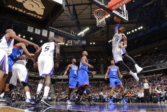 SACRAMENTO, CA - JANUARY 2:  Derrick Williams #13 of the Sacramento Kings dunks the ball against the Philadelphia 76ers at Sleep Train Arena on January 2, 2014 in Sacramento, California. NOTE TO USER: User expressly acknowledges and agrees that, by downlo