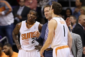 PHOENIX, AZ - DECEMBER 06:  Head coach Jeff Hornacek of the Phoenix Suns talks with Eric Bledsoe #2 and Goran Dragic #1 during the NBA game against the Toronto Raptors at US Airways Center on December 6, 2013 in Phoenix, Arizona. The Suns defeated the Rap