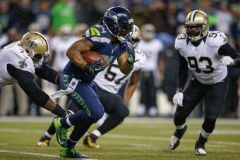 SEATTLE, WA - DECEMBER 02: Running back Marshawn Lynch #24 of the Seattle Seahawks rushes against the New Orleans Saints at CenturyLink Field on December 2, 2013 in Seattle, Washington. (Photo by Otto Greule Jr/Getty Images)