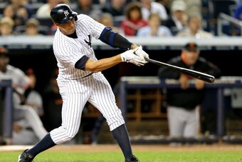 NEW YORK, NY - SEPTEMBER 20:  Alex Rodriguez #13 of the New York Yankees hits a grand slam in the seventh inning against the San Francisco Giants during interleague  play on September 20, 2013 at Yankee Stadium in the Bronx borough of New York City.  (Pho
