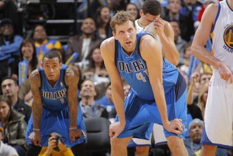 OAKLAND, CA - DECEMBER 11: Monta Ellis #11 and Dirk Nowitzki #41 of the Dallas Mavericks face off against the Golden State Warriors on December 11, 2013 at Oracle Arena in Oakland, California. NOTE TO USER: User expressly acknowledges and agrees that, by 