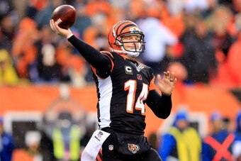 CINCINNATI, OH - JANUARY 05:  Quarterback Andy Dalton #14 of the Cincinnati Bengals passes against the San Diego Chargers during a Wild Card Playoff game at Paul Brown Stadium on January 5, 2014 in Cincinnati, Ohio.  (Photo by Rob Carr/Getty Images)
