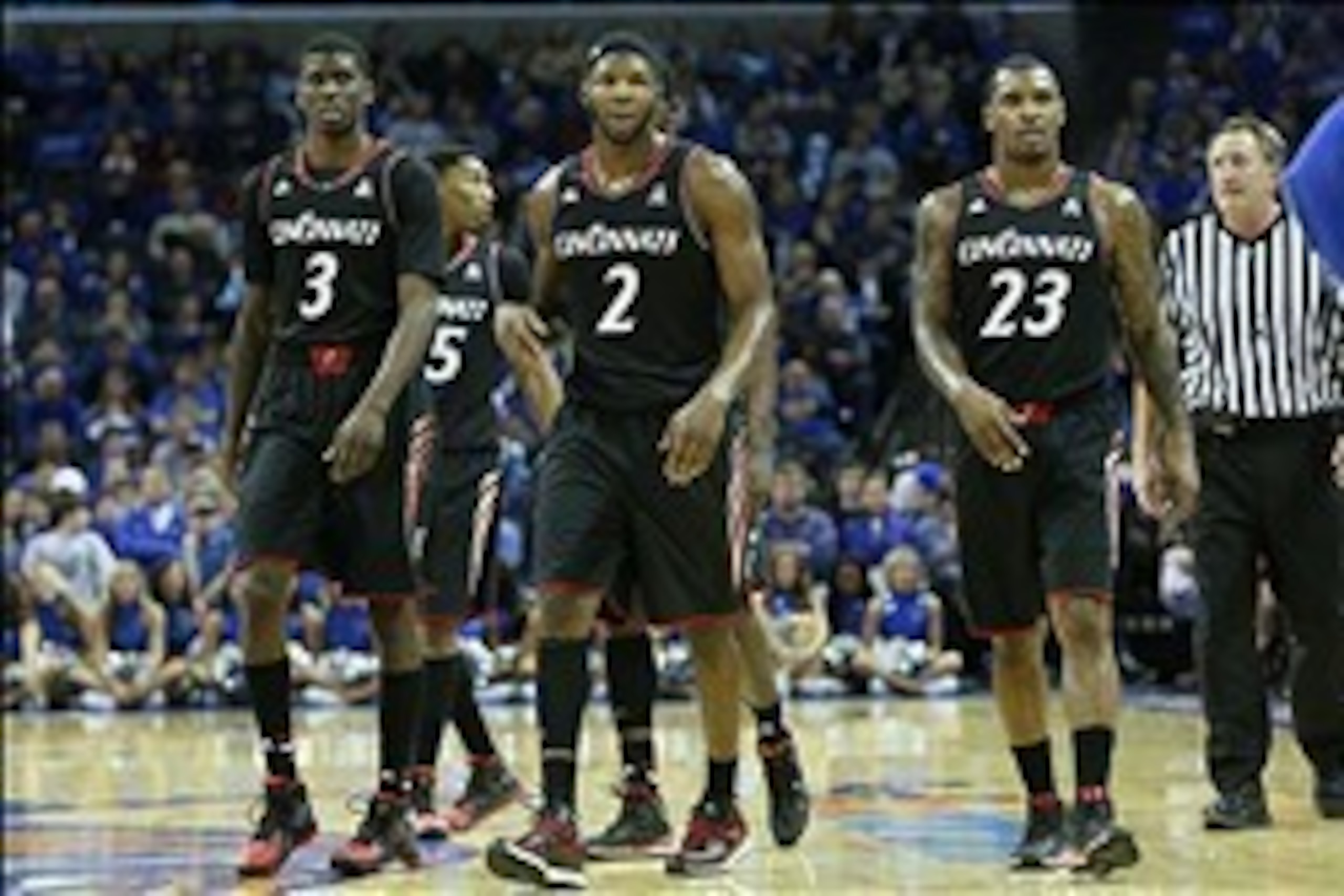 Jan 4, 2014; Memphis, TN, USA; Cincinnati Bearcats forwards Shaquille Thomas (3) Titus Rubles (2) and guard Sean Kilpatrick (23) during the second half against the Memphis Tigers at FedExForum. Cincinnati defeated Memphis 69-53. Mandatory Credit: Nelson C