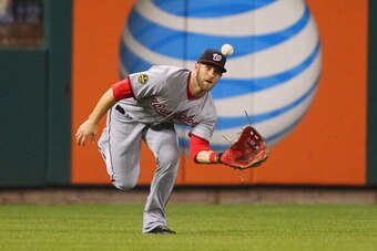 ST. LOUIS, MO - SEPTEMBER 24:  Bryce Harper #34 of the Washington Nationals makes a catch against the St. Louis Cardinals in the first inning at Busch Stadium on September 24, 2013 in St. Louis, Missouri.  (Photo by Dilip Vishwanat/Getty Images)