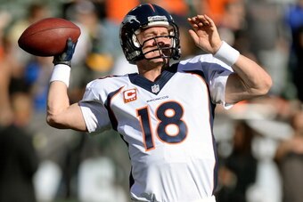 OAKLAND, CA - DECEMBER 29:  Peyton Manning #18 of the Denver Broncos warms up during pre-game warm ups prior to playing the Oakland Raiders at O.co Coliseum on December 29, 2013 in Oakland, California.  (Photo by Thearon W. Henderson/Getty Images)