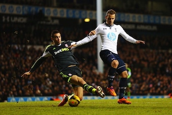 LONDON, ENGLAND - DECEMBER 29:  Roberto Soldado of Tottenham Hotspur is tackled by Geoff Cameron of Stoke City during the Barclays Premier League match between Tottenham Hotspur and Stoke City at White Hart Lane on December 29, 2013 in London, England.  (