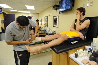 LOS ANGELES, CA - JANUARY 3: Pau Gasol #16 of the Los Angeles Lakers is worked on before a game against the Utah Jazz at STAPLES Center on January 3, 2013 in Los Angeles, California. NOTE TO USER: User expressly acknowledges and agrees that, by downloadin