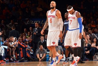 NEW YORK, NY - NOVEMBER 5: (L-R) Tyson Chandler #6 and Carmelo Anthony #7 of the New York Knicks walk on the court against the Charlotte Bobcats during the game on November 5, 2013 at Madison Square Garden in New York City, New York. NOTE TO USER: User ex