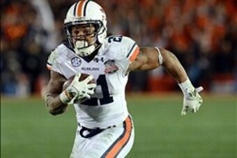 Jan 6, 2014; Pasadena, CA, USA; Auburn Tigers running back Tre Mason (21) scores a touchdown against the Florida State Seminoles during the second half of the 2014 BCS National Championship game at the Rose Bowl.  Mandatory Credit: Jayne Kamin-Oncea-USA T