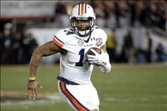 Jan 6, 2014; Pasadena, CA, USA; Auburn Tigers quarterback Nick Marshall (14) runs against the Florida State Seminoles during the second half of the 2014 BCS National Championship game at the Rose Bowl.  Mandatory Credit: Richard Mackson-USA TODAY Sports