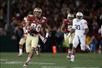Jan 6, 2014; Pasadena, CA, USA; Florida State Seminoles wide receiver Rashad Greene (80) runs with the ball after a catch past  Auburn Tigers defensive end Dee Ford (30) during the second half of the 2014 BCS National Championship game at the Rose Bowl.  