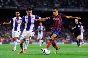 BARCELONA, SPAIN - OCTOBER 05:  Christian Tello of FC Barcelona duels for the ball with Antonio Rukavina of Real Valladolid CF during the La Liga match between FC Barcelona and Real Valladolid CF at Camp Nou on October 5, 2013 in Barcelona, Spain.  (Photo