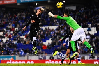 BARCELONA, SPAIN - NOVEMBER 30:  Antoine Griezmann of Real Sociedad scores his team's first goal past Kiko Casilla of RCD Espanyol during the La Liga match between RCD Espanyol and Real Sociedad de Futbol at Cornella-El Prat Stadium on November 30, 2013 i