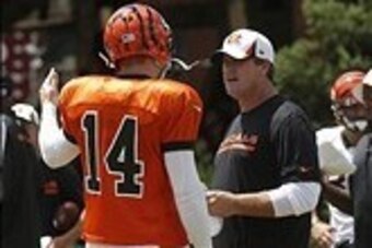 July 28, 2013; Cincinnati, OH, USA; Cincinnati Bengals offensive coordinator Jay Gruden, right, talks with quarterback Andy Dalton (14)during training camp at Paul Brown Stadium. Mandatory Credit: David Kohl-USA TODAY Sports