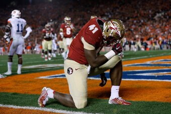 PASADENA, CA - JANUARY 06:  Fullback Chad Abram #41 of the Florida State Seminoles celebrates in the endzone after he scores a touchdown against the Auburn Tigers in the fourth quarter of the 2014 Vizio BCS National Championship Game at the Rose Bowl on J