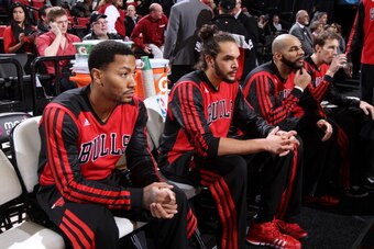 PORTLAND, OR - NOVEMBER 22:  Derrick Rose #1 of the Chicago Bulls sits on the bench before the game against the Portland Trail Blazers on November 22, 2013 at the Moda Center Arena in Portland, Oregon. NOTE TO USER: User expressly acknowledges and agrees 