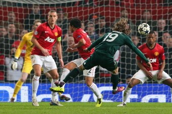 MANCHESTER, ENGLAND - MARCH 05:  Luka Modric of Real Madrid scores his team's first goal during the UEFA Champions League Round of 16 Second leg match between Manchester United and Real Madrid at Old Trafford on March 5, 2013 in Manchester, United Kingdom