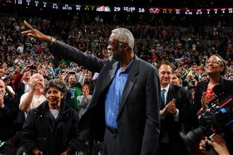 BOSTON, MA - NOVEMBER 1: Alumni legend Bill Russell of the Boston Celtics waves to the crowd during a time out against the Milwaukee Bucks on November 1, 2013 at the TD Garden in Boston, Massachusetts.  NOTE TO USER: User expressly acknowledges and agrees