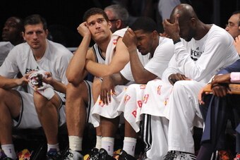 NEW YORK, NY - DECEMBER 03:  Mirza Teletovic #33, Brook Lopez #11, Joe Johnson #7 and Kevin Garnett #2 of the Brooklyn Nets sit on the bench during the fourth quarter against the Denver Nuggets at Barclays Center on December 3, 2013 in the Brooklyn boroug