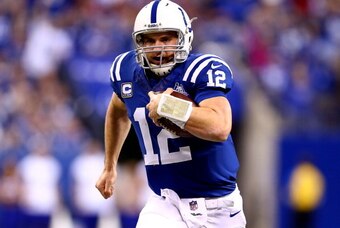 INDIANAPOLIS, IN - JANUARY 04:  Quarterback Andrew Luck #12 of the Indianapolis Colts runs with the ball against the Kansas City Chiefs during a Wild Card Playoff game at Lucas Oil Stadium on January 4, 2014 in Indianapolis, Indiana.  (Photo by Andy Lyons