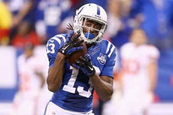 INDIANAPOLIS, IN - JANUARY 04:  T.Y. Hilton #13 of the Indianapolis Colts catches the game winning touchdown pass during the NFL Wild Card Playoff game against the Kansas City Chiefs at Lucas Oil Stadium on January 4, 2014 in Indianapolis, Indiana.  (Phot