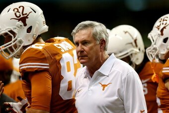 SAN ANTONIO, TX - DECEMBER 30: Head coach Mack Brown of the Texas Longhorns looks on against the Oregon Ducks during the Valero Alamo Bowl at the Alamodome on December 30, 2013 in San Antonio, Texas.  (Photo by Ronald Martinez/Getty Images)