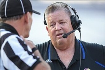 Sep 14, 2013; Houston, TX, USA; Kansas Jayhawks head coach Charlie Weiss talks to an official during the first quarter against the Rice Owls at Rice Stadium. Mandatory Credit: Troy Taormina-USA TODAY Sports
