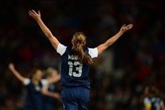 Aug 6, 2012; Manchester , United Kingdom; USA forward (13) Alex Morgan celebrates as the game ends after scoring the winning goal in extra time against Canada in the semi finals during the London 2012 Olympic Games at Old Trafford. Mandatory Credit: Mark 