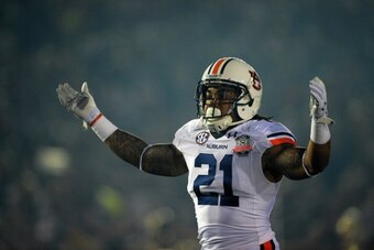 PASADENA, CA - JANUARY 06:  Running back Tre Mason #21 of the Auburn Tigers reacts to a play against the Florida State Seminoles during the 2014 Vizio BCS National Championship Game at the Rose Bowl on January 6, 2014 in Pasadena, California.  (Photo by H