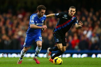 LONDON, ENGLAND - DECEMBER 14: Juan Mata of Chelsea is marked by Stuart O'Keefe of Crystal Palace during the Barclays Premier League match between Chelsea and Crystal Palace at Stamford Bridge on December 14, 2013 in London, England. (Photo by Paul Gilham