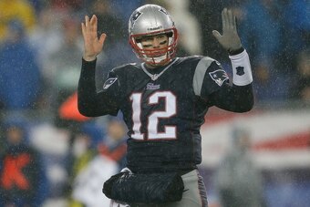 FOXBORO, MA - DECEMBER 29:  Tom Brady #12 of the New England Patriots gestures in the red zone during a game with the Buffalo Bills in the second half at Gillette Stadium on December 29, 2013 in Foxboro, Massachusetts. (Photo by Jim Rogash/Getty Images)