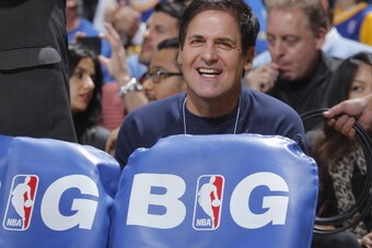 OAKLAND, CA - DECEMBER 11: Dallas Mavericks' owner Mark Cuban watches his team face off against the Golden State Warriors on December 11, 2013 at Oracle Arena in Oakland, California. NOTE TO USER: User expressly acknowledges and agrees that, by downloadin