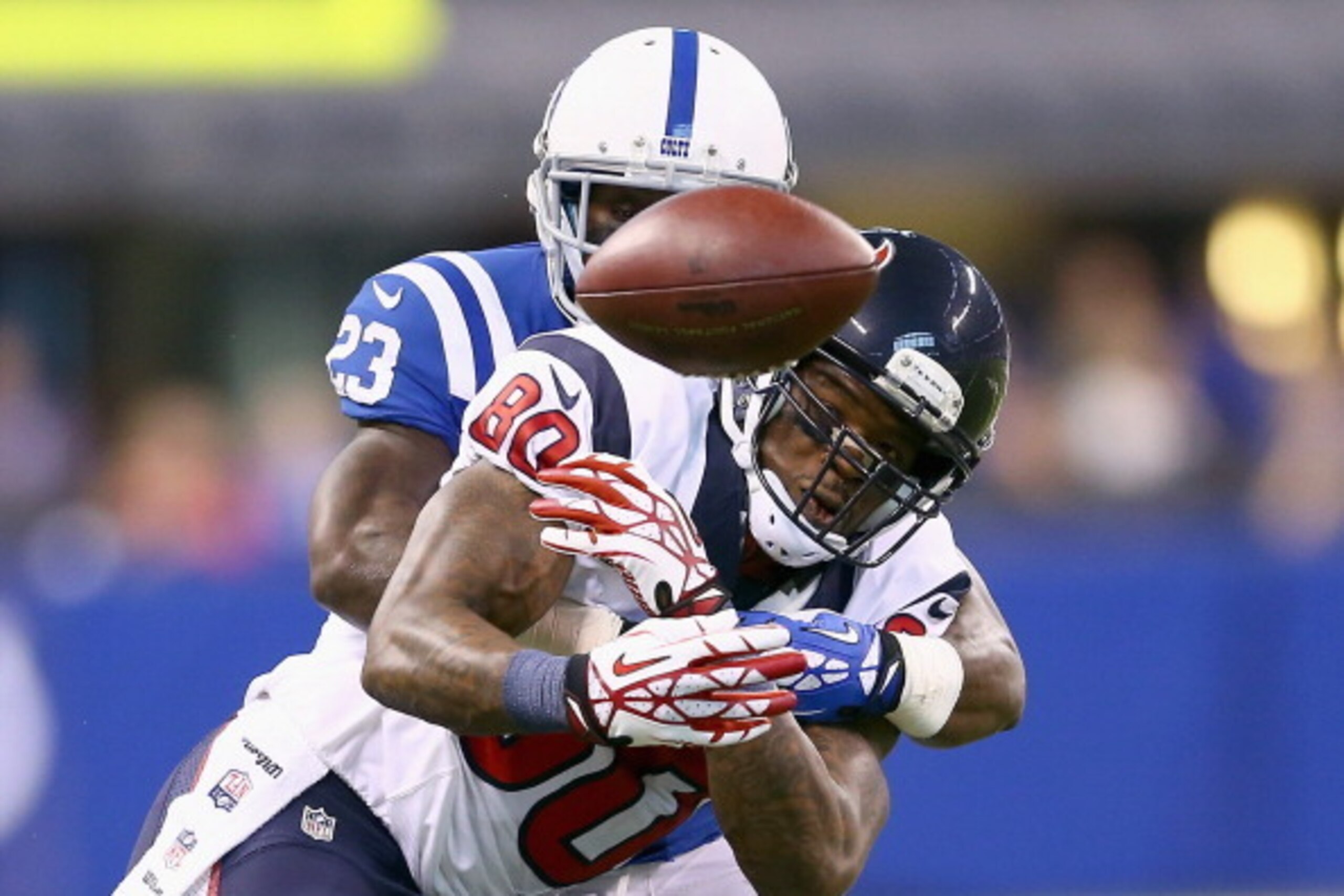 INDIANAPOLIS, IN - DECEMBER 15:  Andre Johnson #80 Houston Texans drops a pass while defended by Vontae Davis #23  of the Indianapolis Colts during the NFL game at Lucas Oil Stadium on December 15, 2013 in Indianapolis, Indiana.  (Photo by Andy Lyons/Gett
