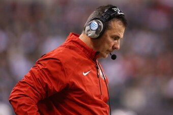 INDIANAPOLIS, IN - DECEMBER 07:  Head coach Urban Meyer of the Ohio State Buckeyes looks down during the Big Ten Conference Championship game against the Michigan State Spartans at Lucas Oil Stadium on December 7, 2013 in Indianapolis, Indiana.  (Photo by