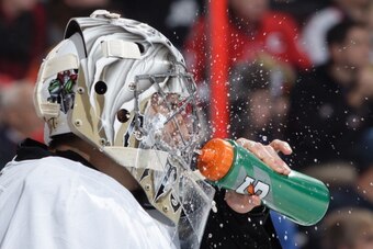 OTTAWA, ON - DECEMBER 23: Marc-Andre Fleury #29 of the Pittsburgh Penguins sprays water on his face during an NHL game against the Ottawa Senators at Canadian Tire Centre on December 23, 2013 in Ottawa, Ontario, Canada.  (Photo by Jana Chytilova/NHLI via 