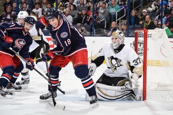 COLUMBUS, OH - DECEMBER 29:  R.J. Umberger #18 of the Columbus Blue Jackets skates in front of goaltender Jeff Zatkoff #37 of the Pittsburgh Penguins on December 29, 2013 at Nationwide Arena in Columbus, Ohio. Pittsburgh defeated Columbus 5-3. (Photo by J