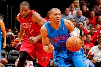 MIAMI, FL - DECEMBER 25: Russell Westbrook #0 of the Oklahoma City Thunder drives on a fast break after stealing the ball from Dwyane Wade #3 of the Miami Heat during a Christmas Day game on December 25, 2012 at American Airlines Arena in Miami, Florida. 
