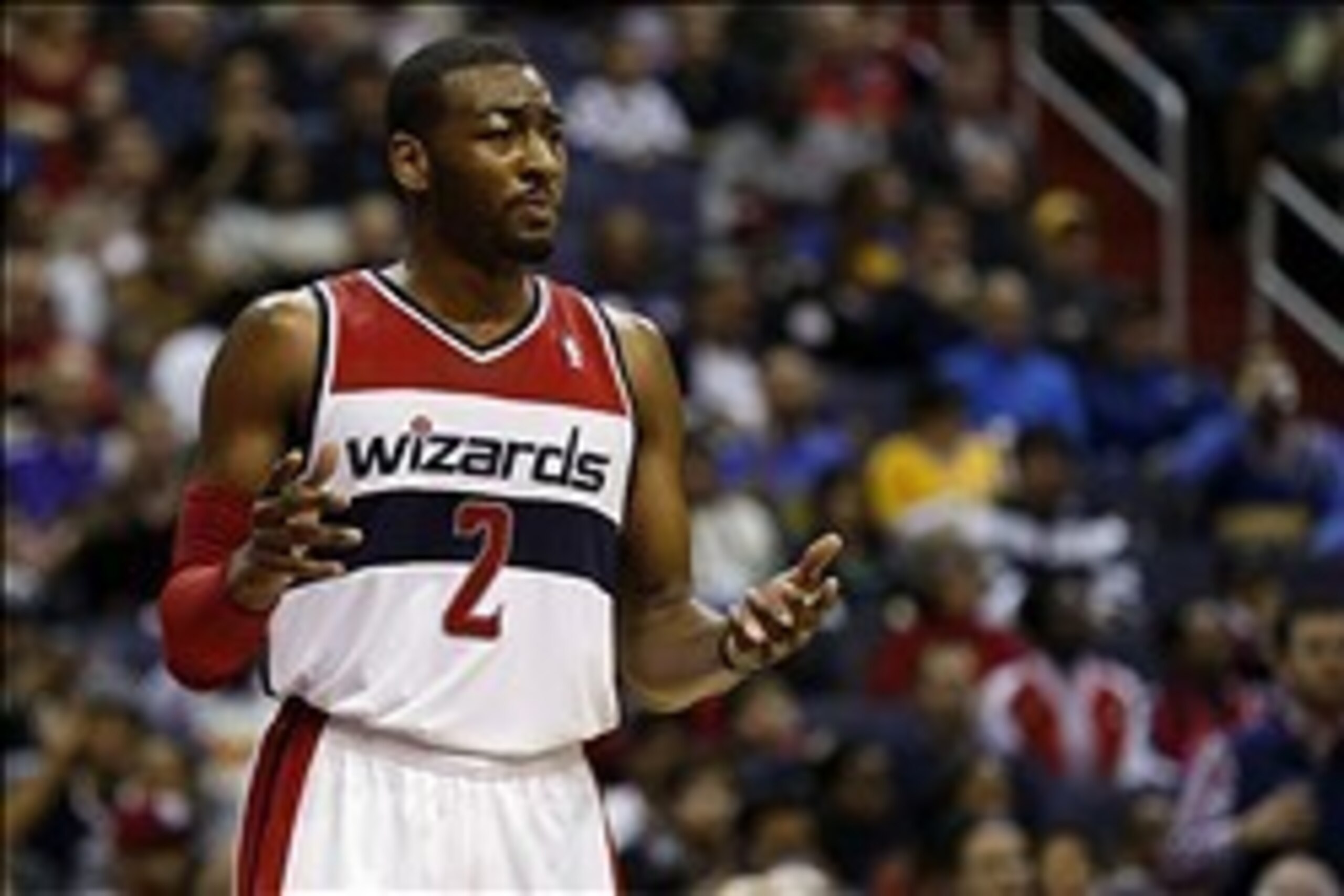 Jan 5, 2014; Washington, DC, USA; Washington Wizards point guard John Wall (2) reacts on the court against the Golden State Warriors in the third quarter at Verizon Center. The Warriors won 112-96. Mandatory Credit: Geoff Burke-USA TODAY Sports