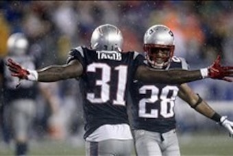 Sep 12, 2013; Foxborough, MA, USA; New England Patriots cornerback Aqib Talib (31) celebrates an interception against the New York Jets with strong safety Steve Gregory (28) during the second half at Gillette Stadium. Mandatory Credit: Mark L. Baer-USA TO