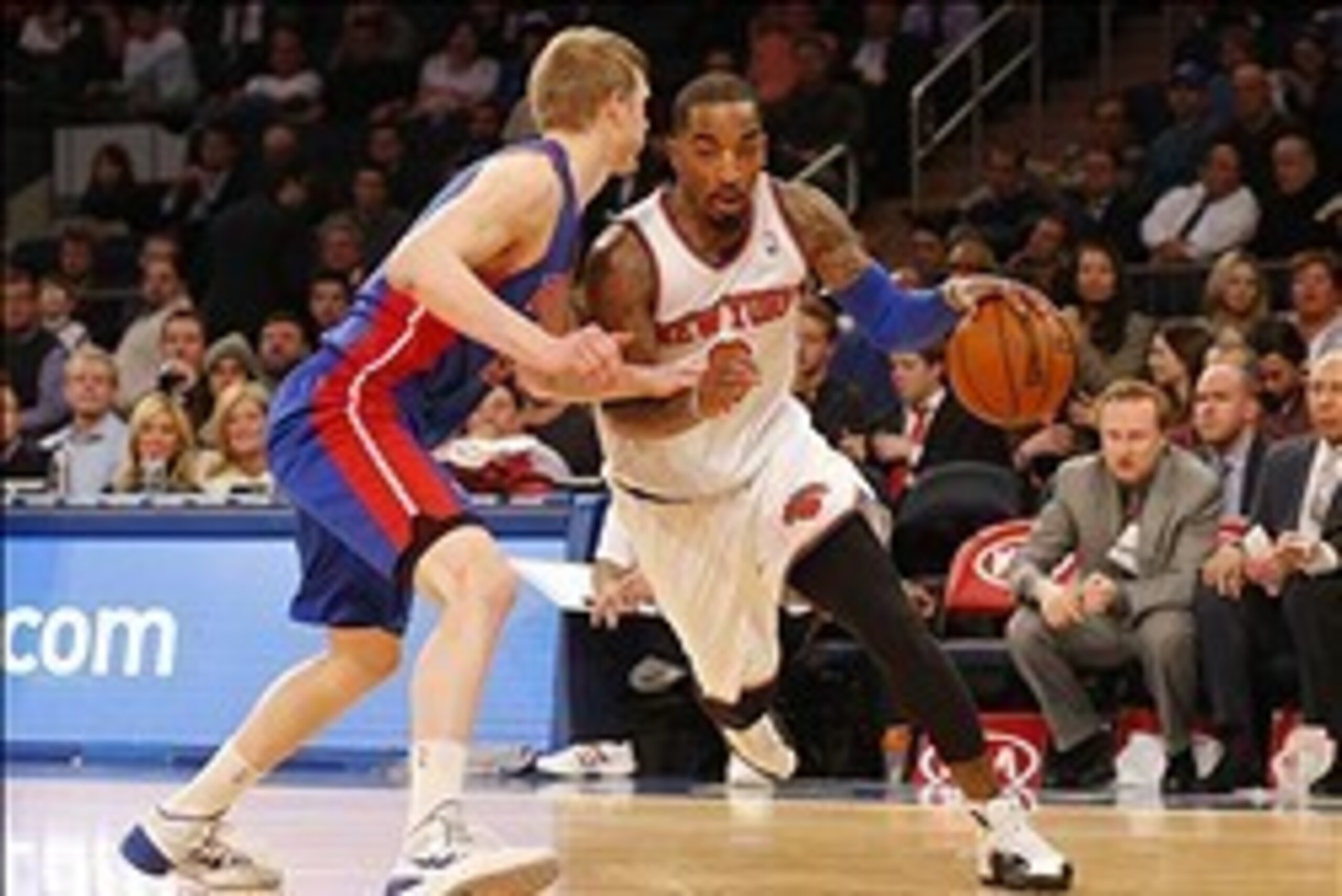 Jan 7, 2014; New York, NY, USA;  New York Knicks shooting guard J.R. Smith (8) dribbles the ball around Detroit Pistons small forward Kyle Singler (25) during the second half at Madison Square Garden. The Knicks won 89-85. Mandatory Credit: Jim O'Connor-U