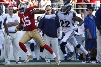 SAN FRANCISCO, CA - DECEMBER 1: Wide receiver Michael Crabtree #15 of the San Francisco 49ers rushes for a 60-yard gain as cornerback Trumaine Johnson #22 of  the St. Louis Rams defends during the third quarter of their game on December 1, 2013 at Candles