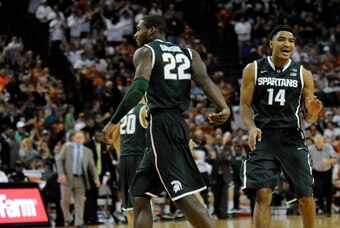 Dec 21, 2013; Austin, TX, USA; Michigan State Spartans guards Branden Dawson (22) and Gary Harris (14) react against the Texas Longhorns during the second half at the Frank Erwin Special Events Center. Michigan State beat Texas 92-78. Mandatory Credit: Br