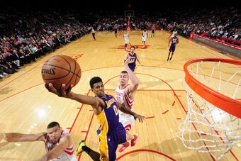 HOUSTON, TX - JANUARY 8:  Nick Young #0 of the Los Angeles Lakers shoots against the Houston Rockets on January 8, 2014 at the Toyota Center in Houston, Texas. NOTE TO USER: User expressly acknowledges and agrees that, by downloading and or using this pho