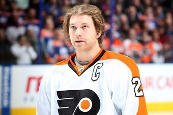 EDMONTON, AB - DECEMBER 28: Claude Giroux #28 of the Philadelphia Flyers stands for the singing of the national anthem prior to a game against the Edmonton Oilers on December 28, 2013 at Rexall Place in Edmonton, Alberta, Canada. (Photo by Marko Ditkun/NH