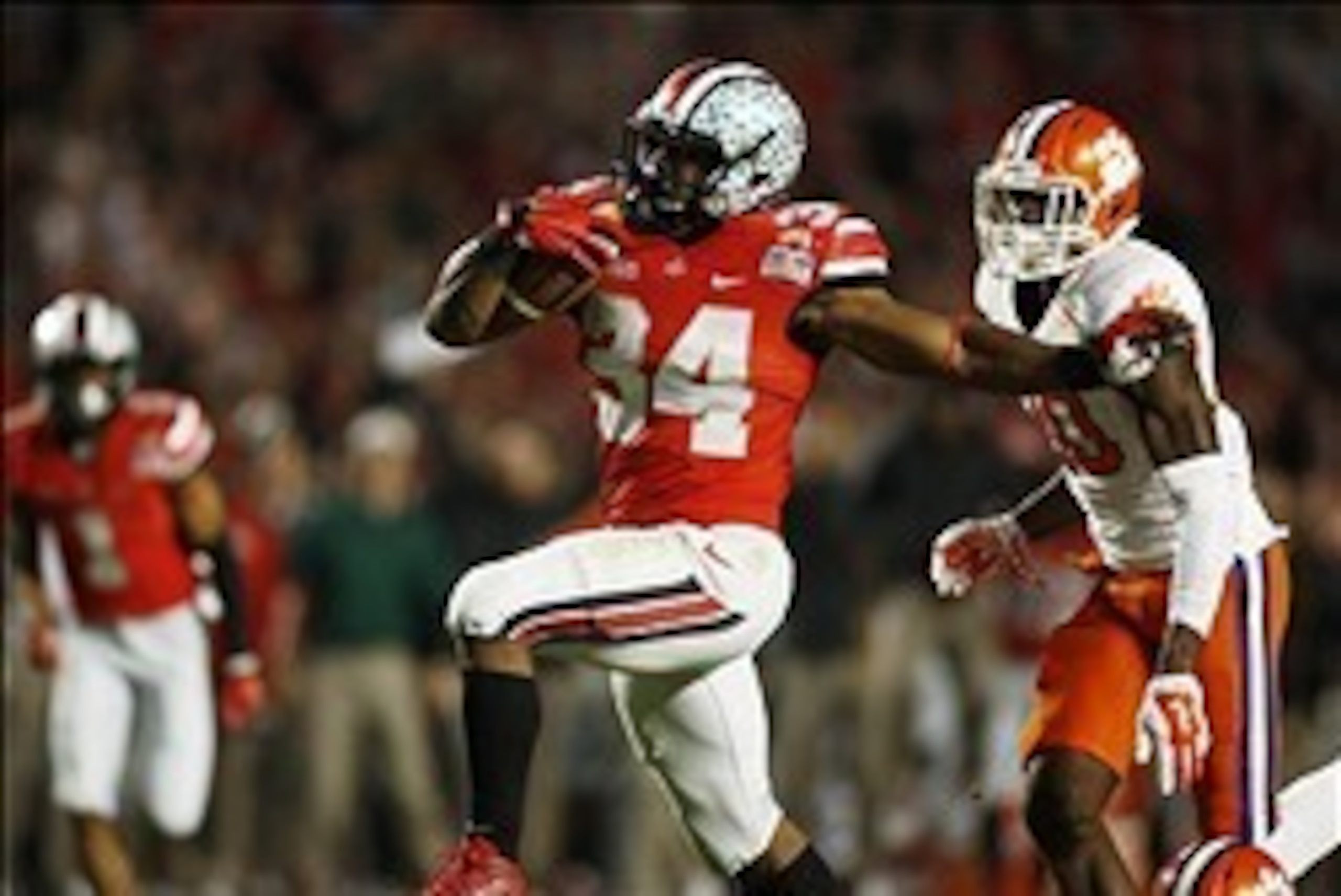 Jan 3, 2014; Miami Gardens, FL, USA; Ohio State Buckeyes running back Carlos Hyde (34) runs the ball against the Clemson Tigers in the second half of the 2014 Orange Bowl college football game at Sun Life Stadium. Mandatory Credit: Robert Mayer-USA TODAY 