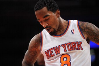 NEW YORK, NY - OCTOBER 25:  J.R. Smith #8 of the New York Knicks reacts during the first half against the Charlotte Bobcats at Madison Square Garden on October 25, 2013 in New York City. The Bobcats defeated the Knicks 85-83.  NOTE TO USER: User expressly